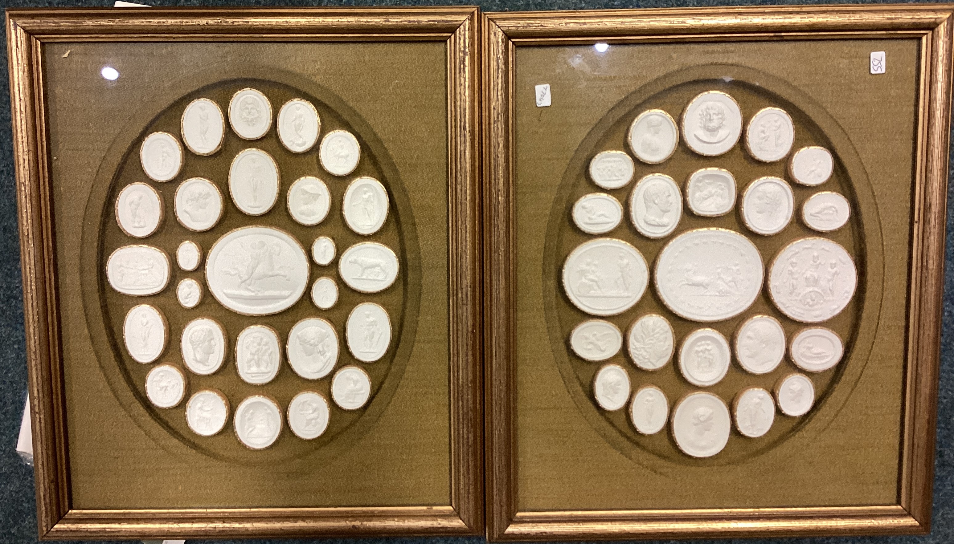 A pair of framed plaster ingots.