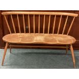 ERCOL: A two seater stick back bench.