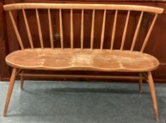 ERCOL: A two seater stick back bench.