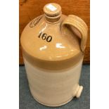 A large stoneware bottle.