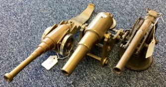 A Victorian brass cannon together with a scratch built cannon and one other.