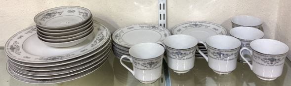 A Diane pattern porcelain dinner / tea set.
