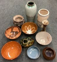 A selection of 11 various studio pottery items.