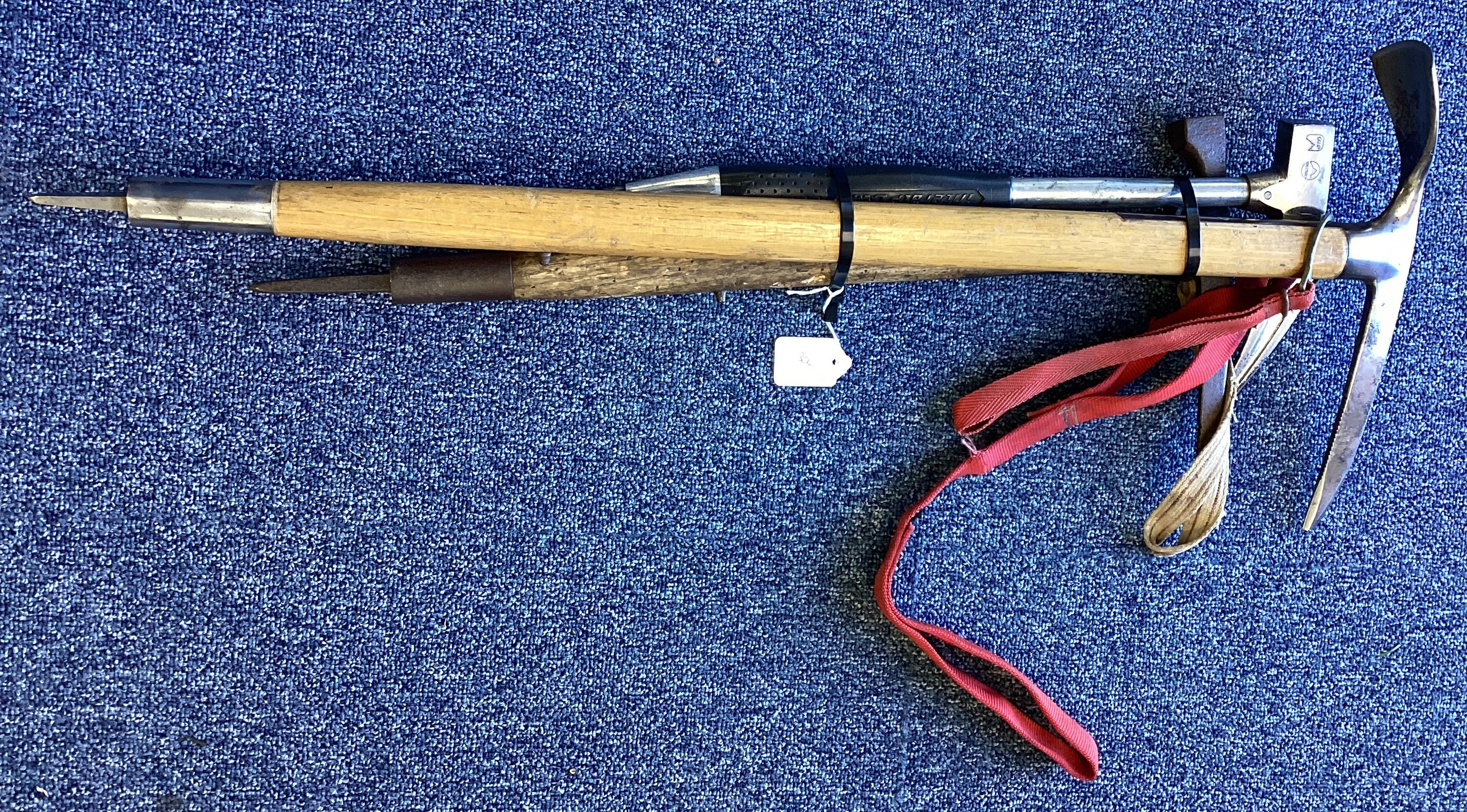 Two climbing axes together with an ice pick.