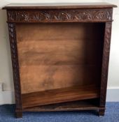 An oak carved bookcase.