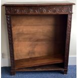 An oak carved bookcase.
