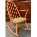 ERCOL: A small rocking chair. Est. £40 - £60.