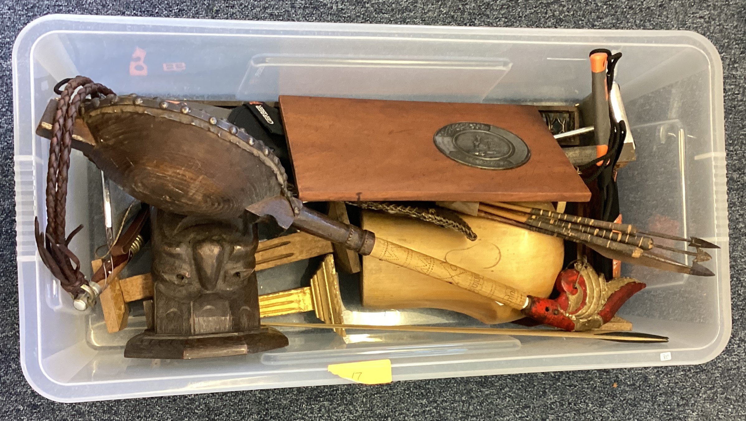 A box containing stands, arrows etc.