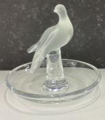 LALIQUE: A small glass pin dish decorated with figure of bird.