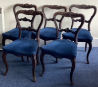 A set of six Victorian mahogany hoop back chairs.
