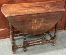 An oak drop leaf table.