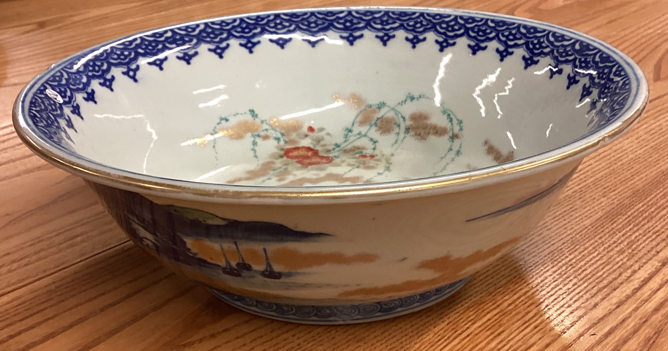 A large Chinese bowl decorated with buildings. Signed to base. - Image 2 of 4