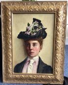 A gilt framed oil on canvas depicting a portrait of a lady / suffragette.
