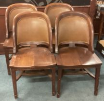 A set of four mahogany dining chairs with cane backs.