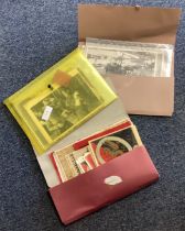 A wallet containing film stills together with Military ephemera and Royalty souvenirs.