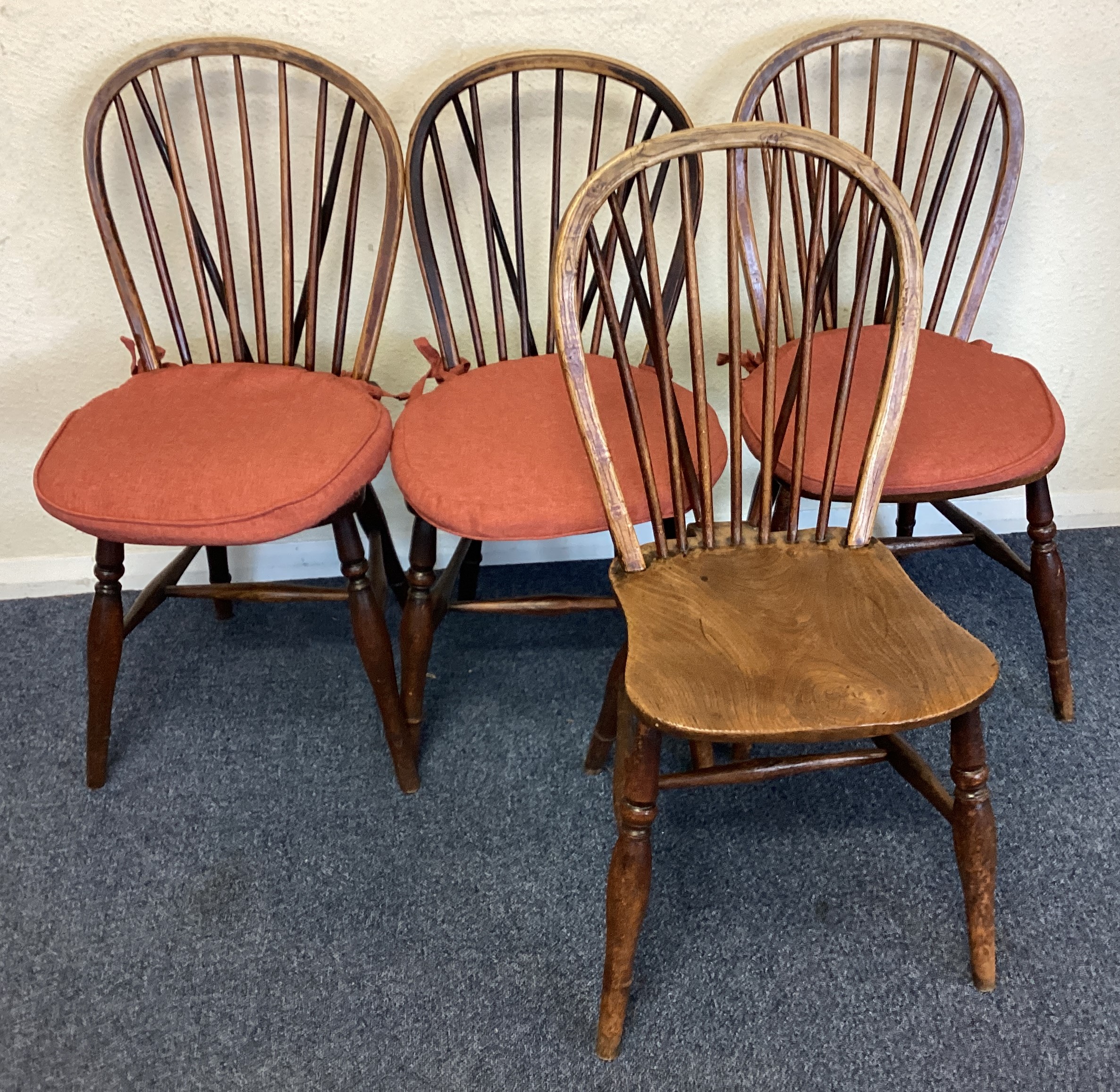 A set of four oak wheelback chairs.