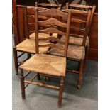 A set of oak stick back chairs.