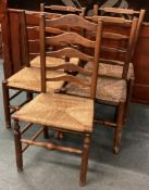 A set of oak stick back chairs.