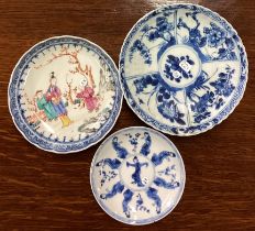 A group of three Chinese tea bowls with figural decoration.