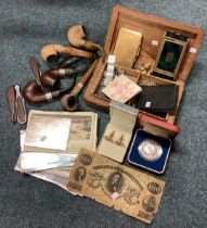 A collection of watches, costume jewellery, pipes etc.
