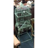A painted green bird cage.