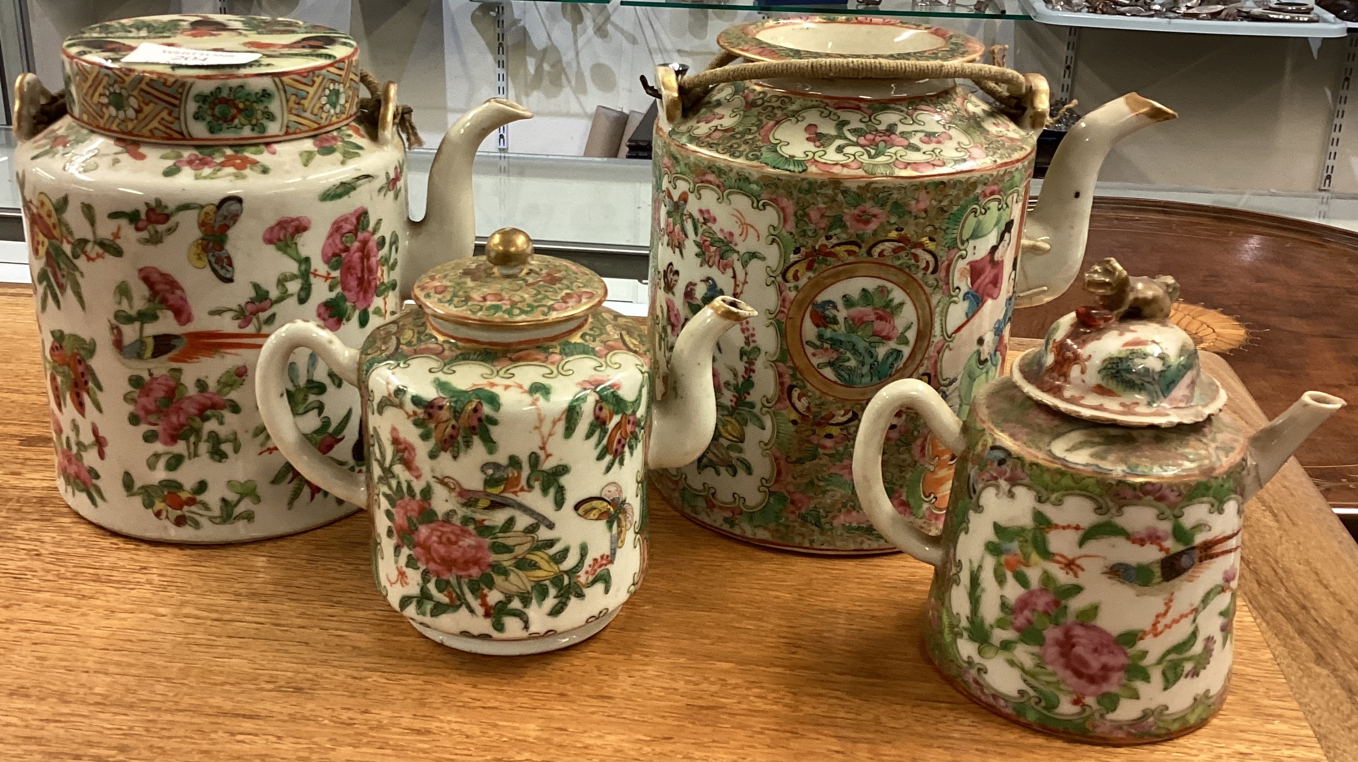 Two large Chinese teapots together with two smaller examples.