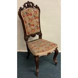 A Victorian scroll back chair.