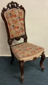 A Victorian scroll back chair.