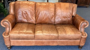 A good leather button back sofa.