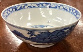 A Nanking blue and white dish of typical form. Signed to base.