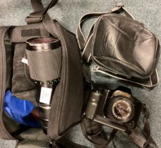 A bag containing camera lenses etc.
