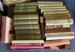 A box containing gardening and plant books.