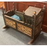 A continental carved rocking cot.