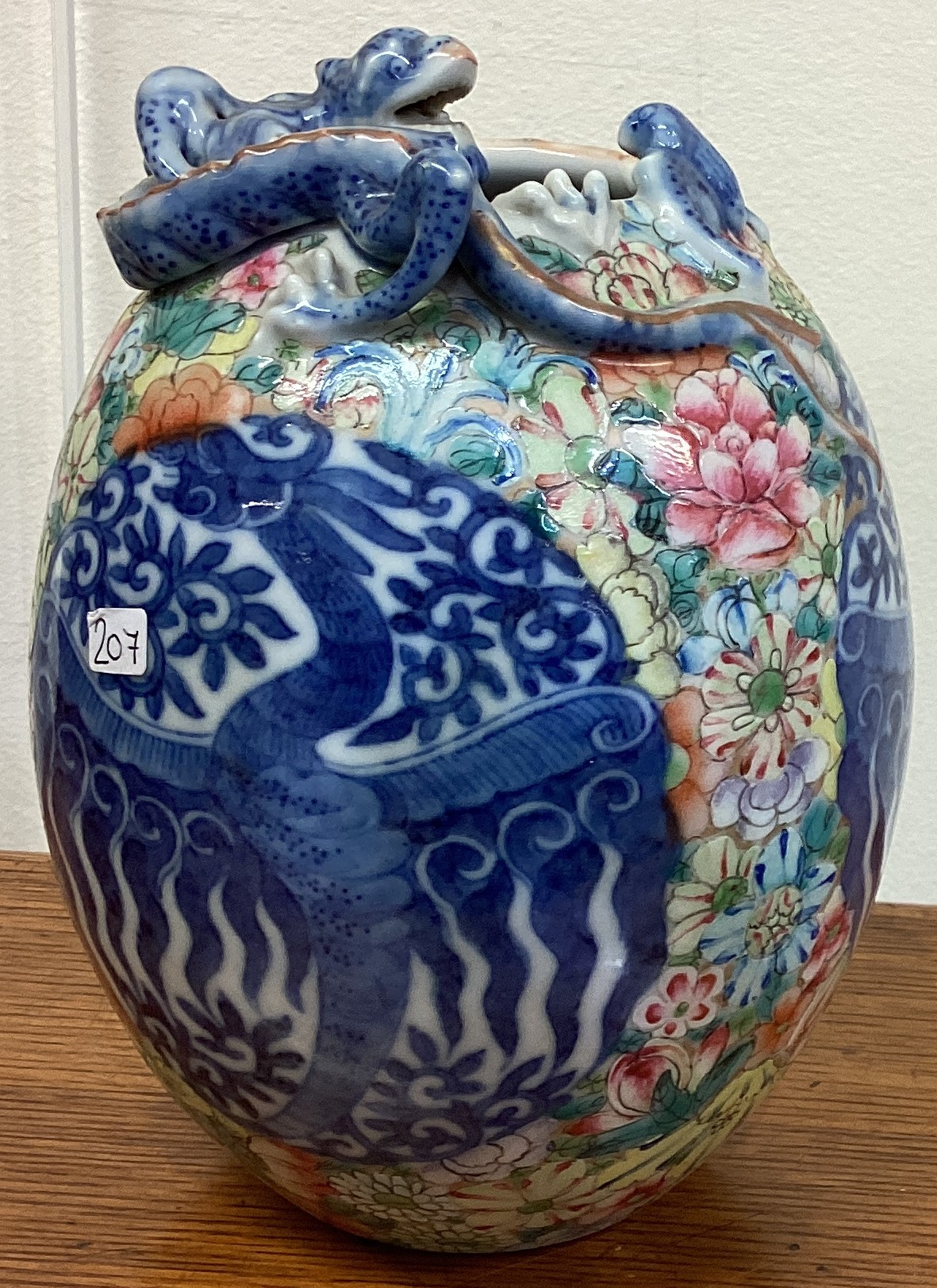 A good Chinese vase attractively decorated with dragons. Signed to base.