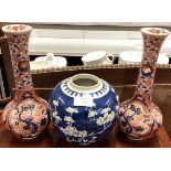 A tall pair of Imari vases together with a large Chinese blue and white vase.