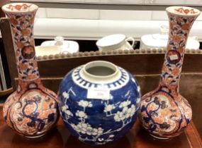 A tall pair of Imari vases together with a large Chinese blue and white vase.