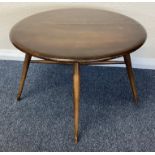 ERCOL: A small drop flap table.