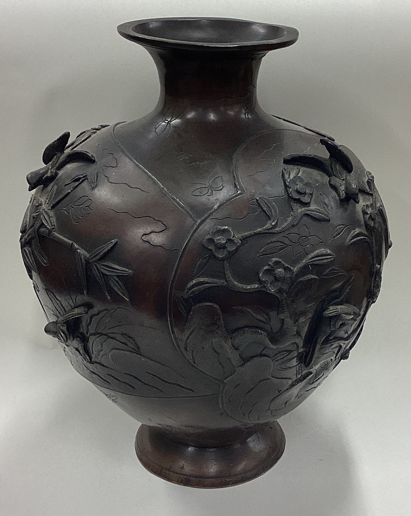 A large Chinese bronze vase with floral decoration.