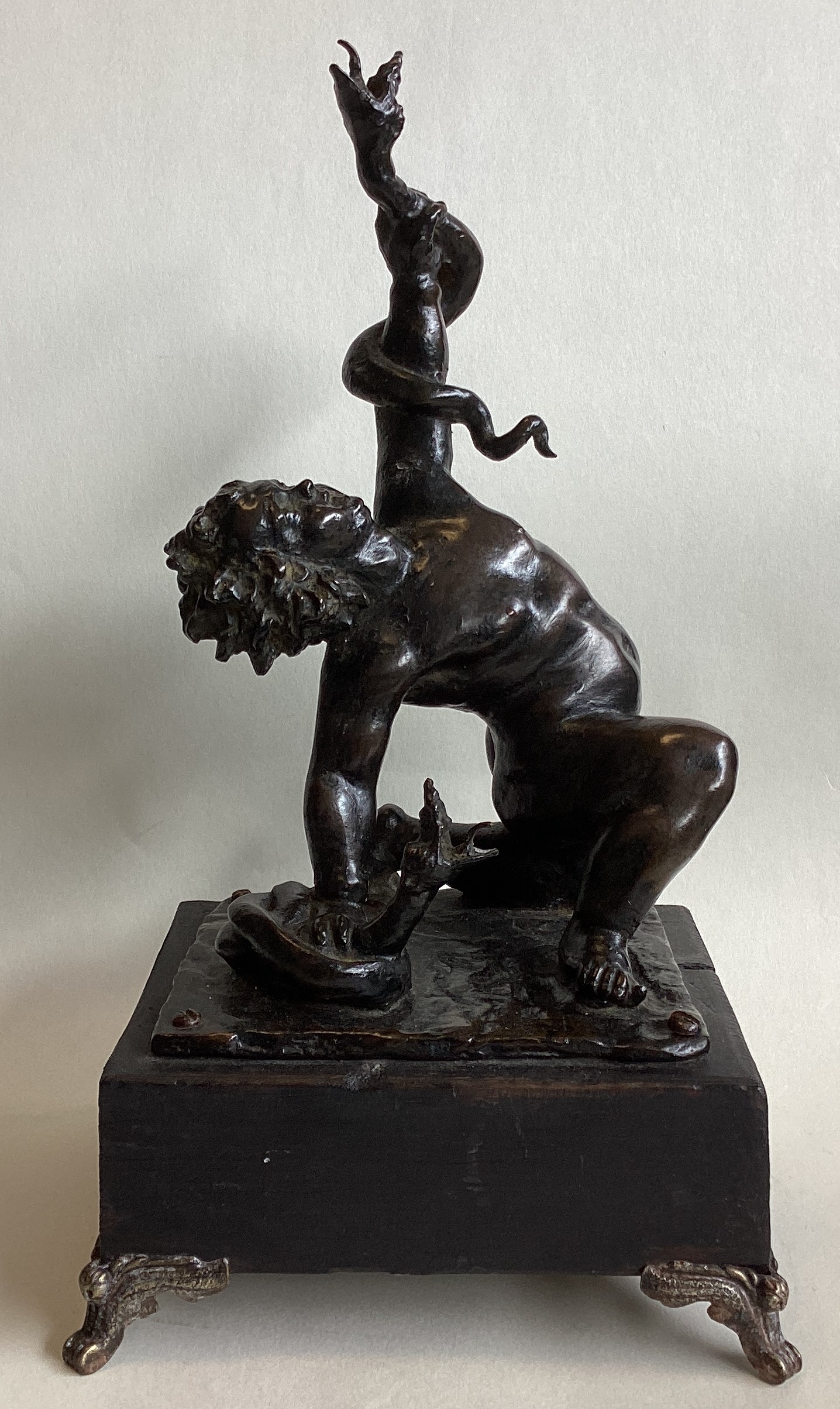 AFTER FRANCESCO FANELLI: A bronze figure of Hercules strangling serpents.