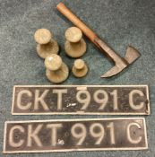 A collection of brass weights, fire axe etc.