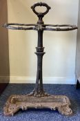 A large cast iron stick stand.