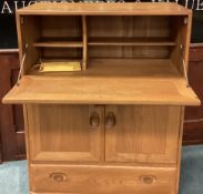 ERCOL: A good drop flap cupboard with single drawer.