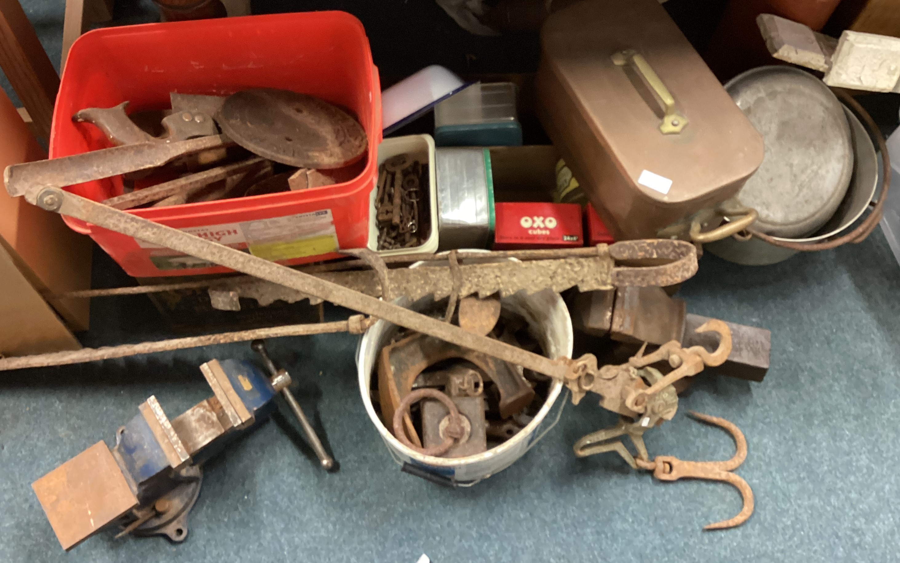 A mixed lot of old metal signs, chimney crook, two vices etc.