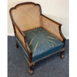 A small mahogany cane back chair.