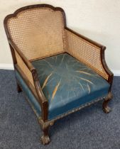 A small mahogany cane back chair.