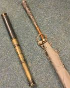 An Indian silver umbrella together with a good brass telescope.