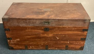 An Antique brass bound camphorwood trunk.