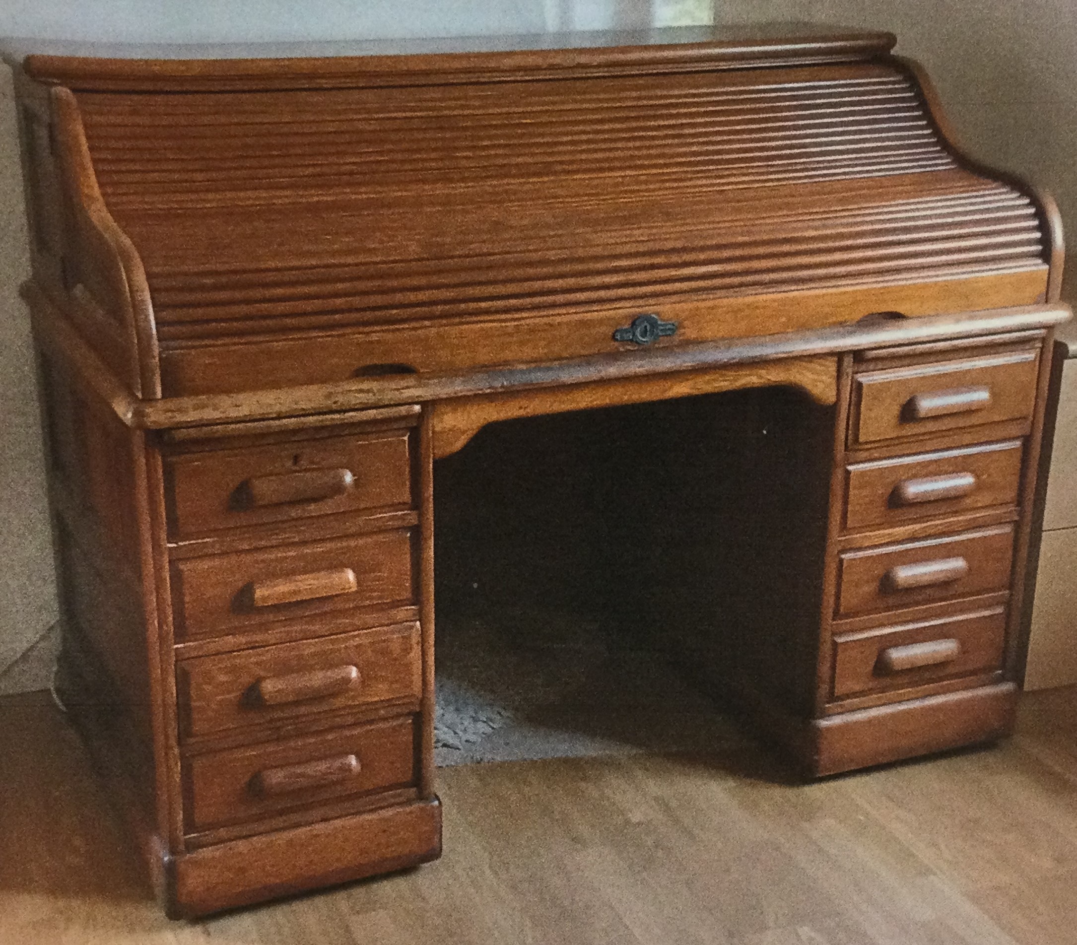 A large oak cylinder top desk.