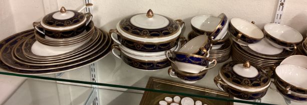 A large blue and gilt tea and dinner service.