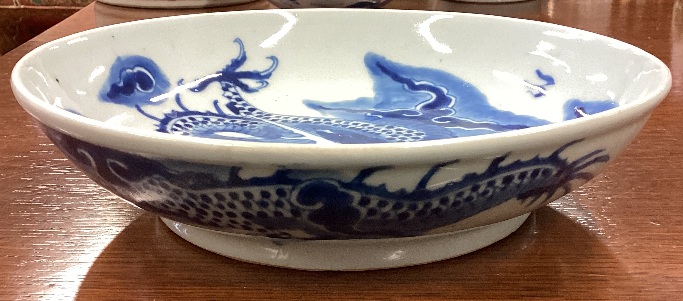 A large Chinese blue and white bowl with dragon decoration. - Image 3 of 3